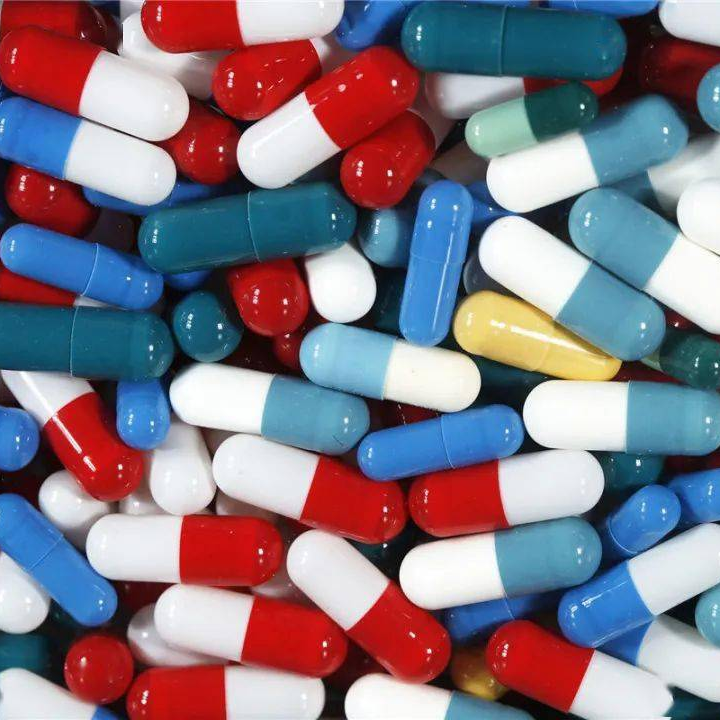 A pile of colorful hard capsules